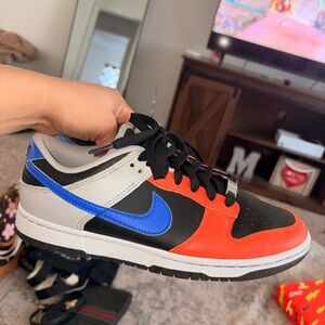 Nike Black and Orange Low-Top Sneakers with Blue Swoosh